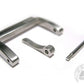 Brushed stainless steel watch buckle disassembled into three separate pieces. 
